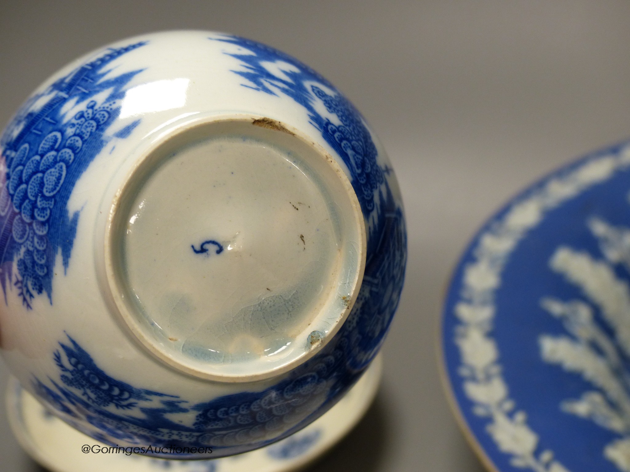 A 19th century Wedgwood blue jasper dish in classical style, five leaf dishes, a blue painted creamware saucer and a blue printed teabowl